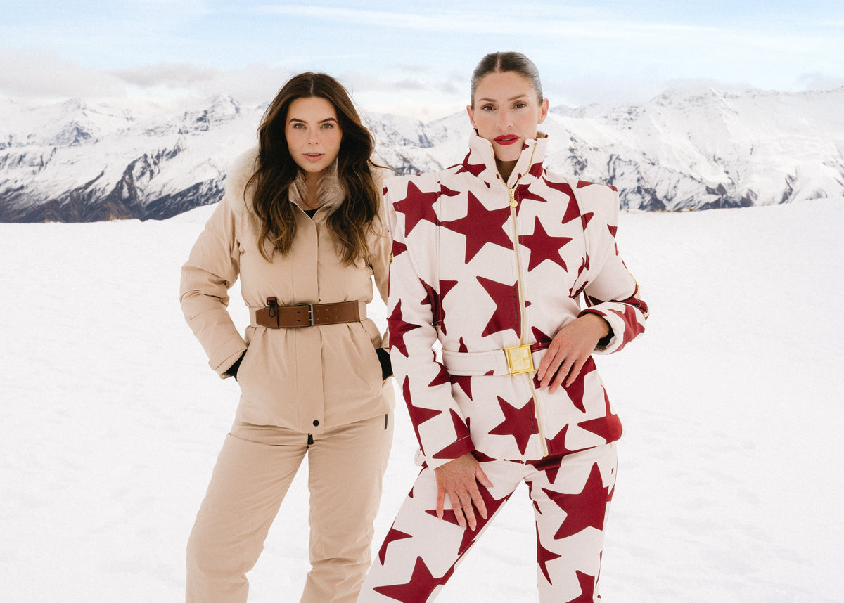 Two models in 2ND LANE ski suits standing together in Queenstown, from a heli editorial shoot